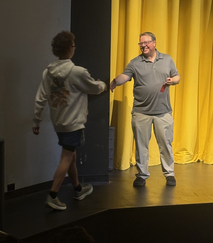 student receiing a math award