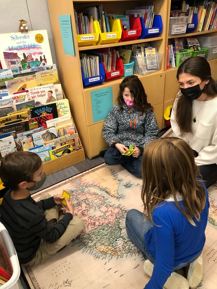 students working with a teacher 