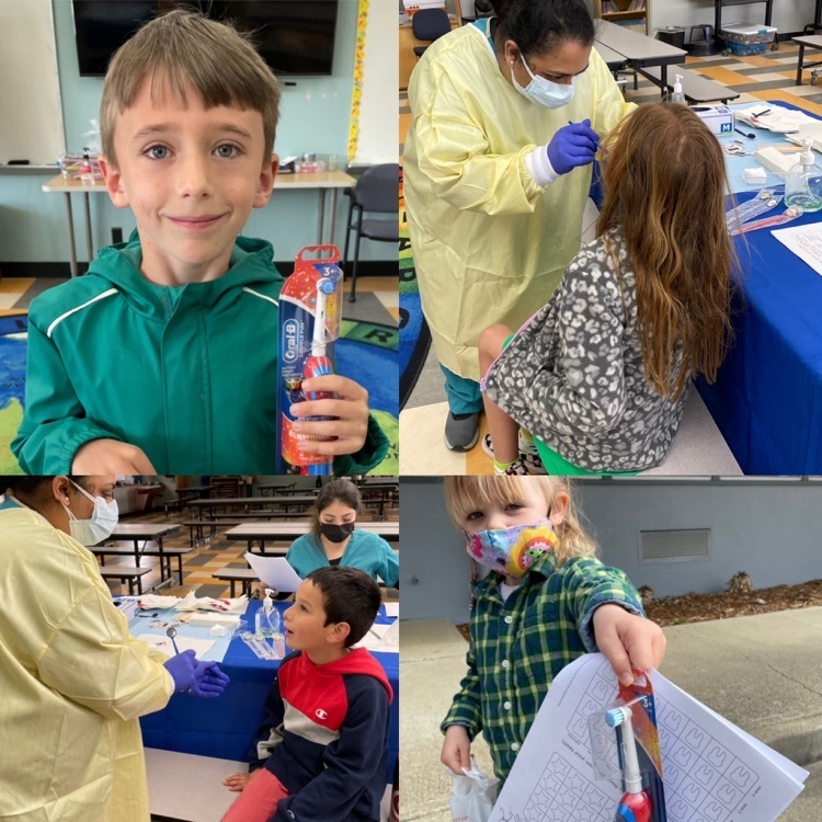 students with toothbrushes and getting dental screenings