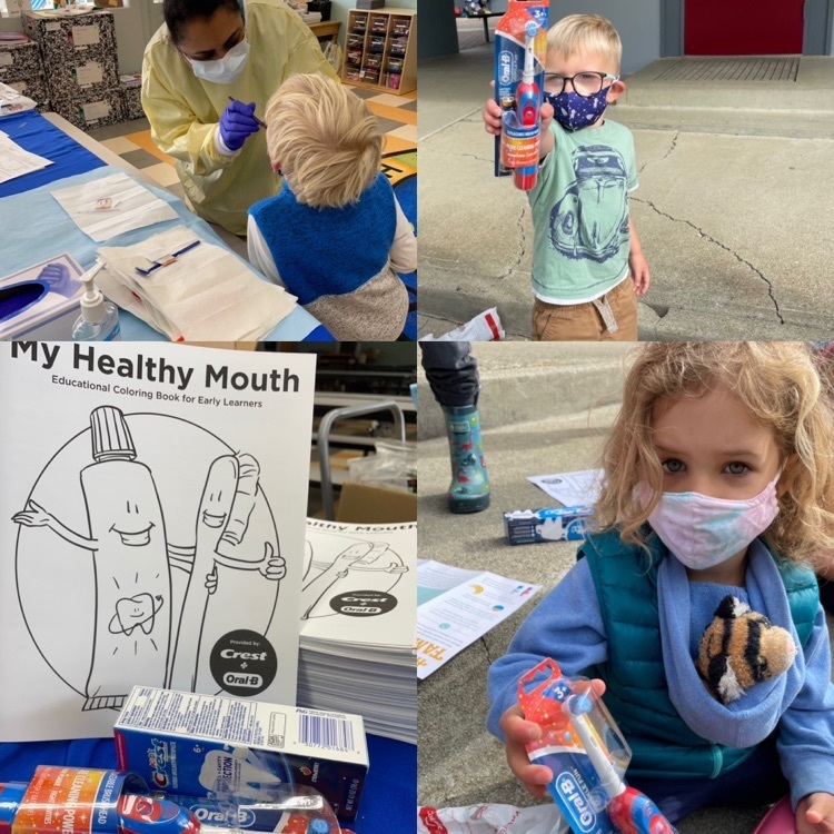 students with toothbrushes and getting their dental screenings