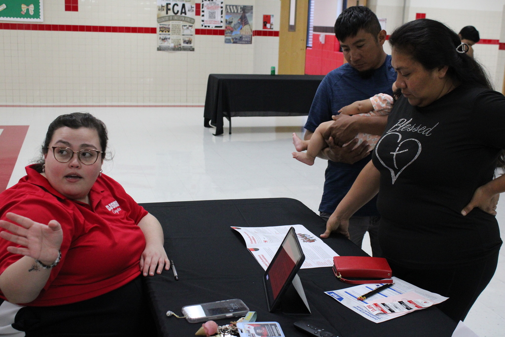 Parents speaking to staff member