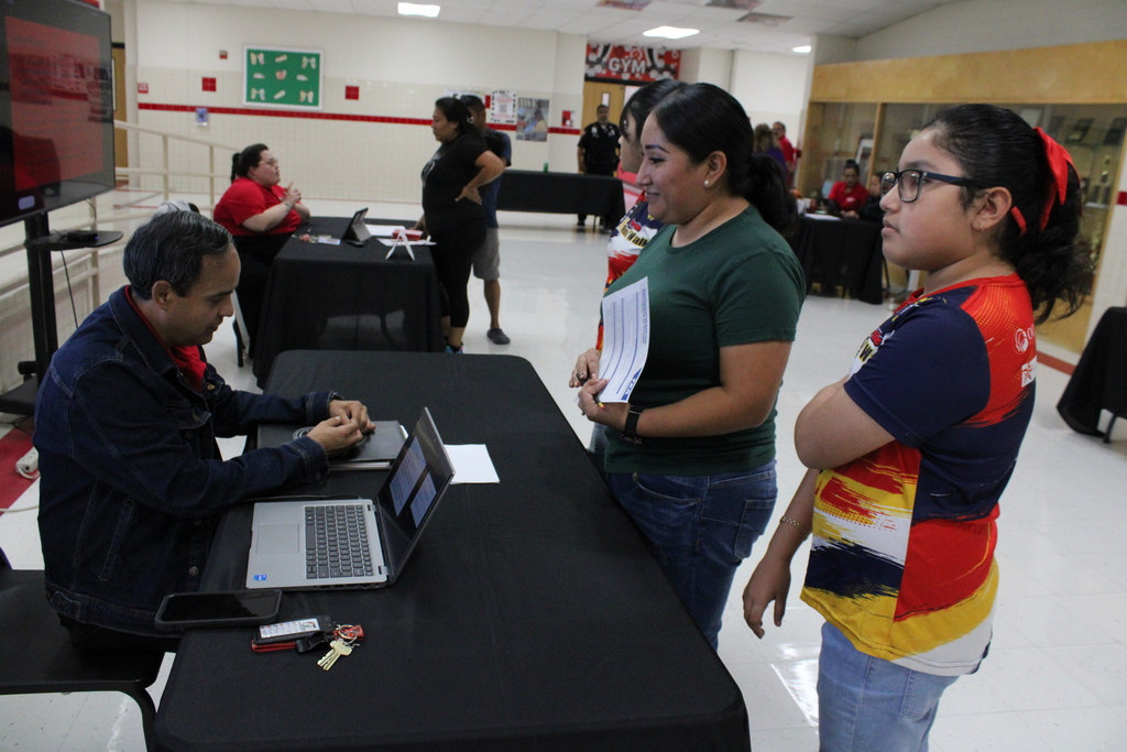 Parents speaking to staff member
