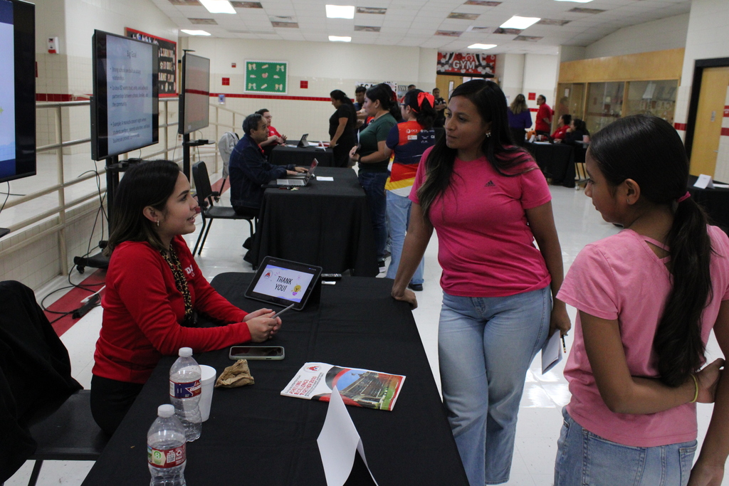 Parents speaking to staff member