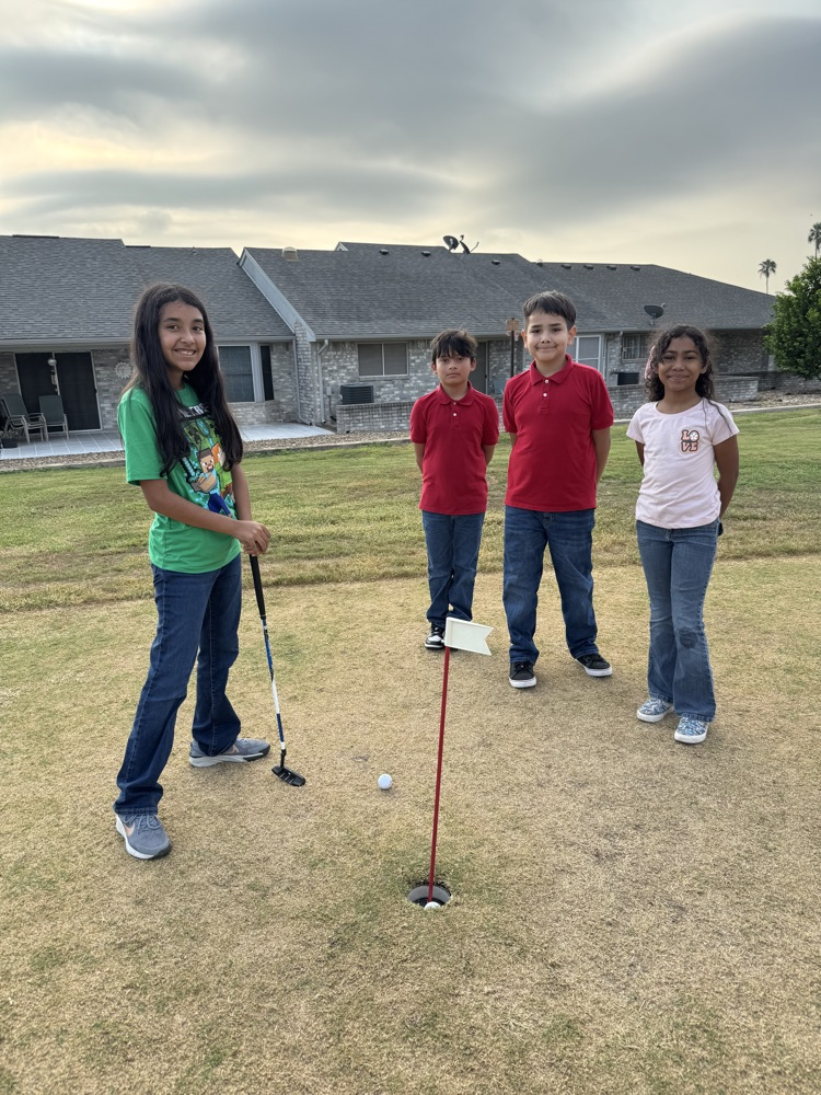 students playing golf 