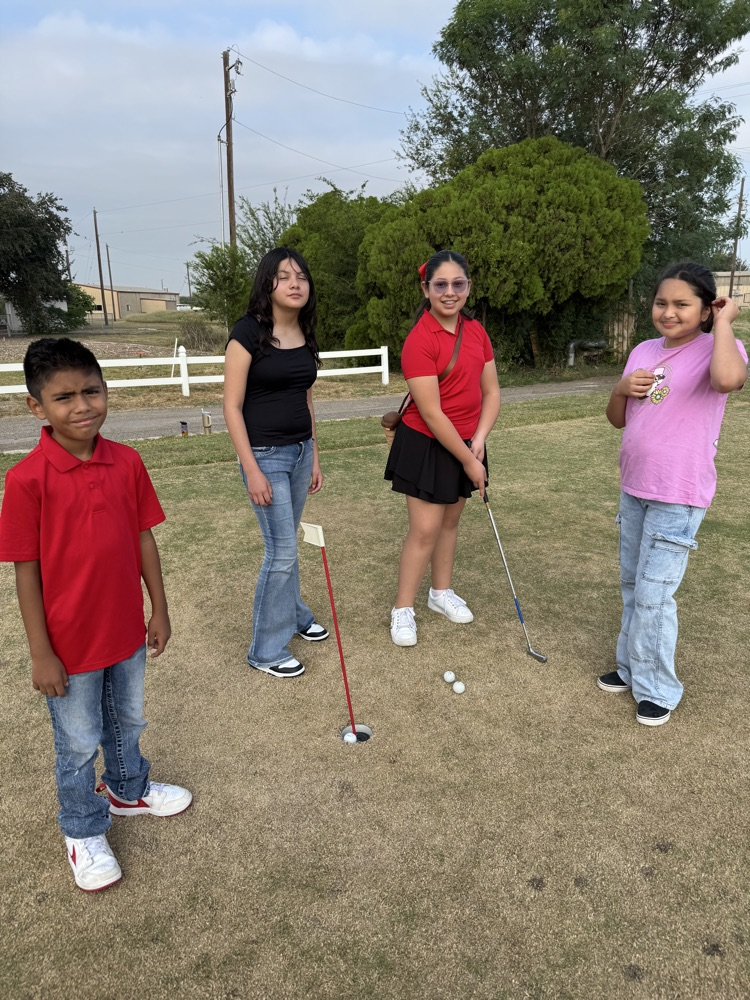 students playing golf 