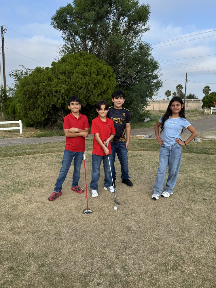 students playing golf 