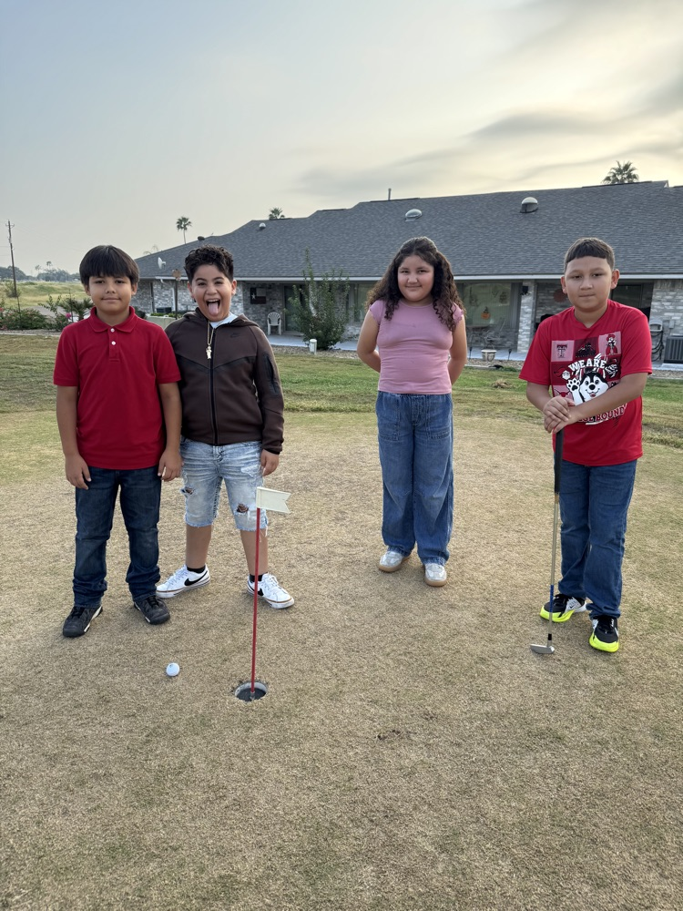 students playing golf 