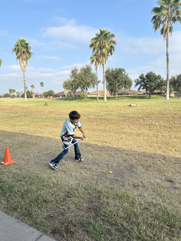 students playing golf 