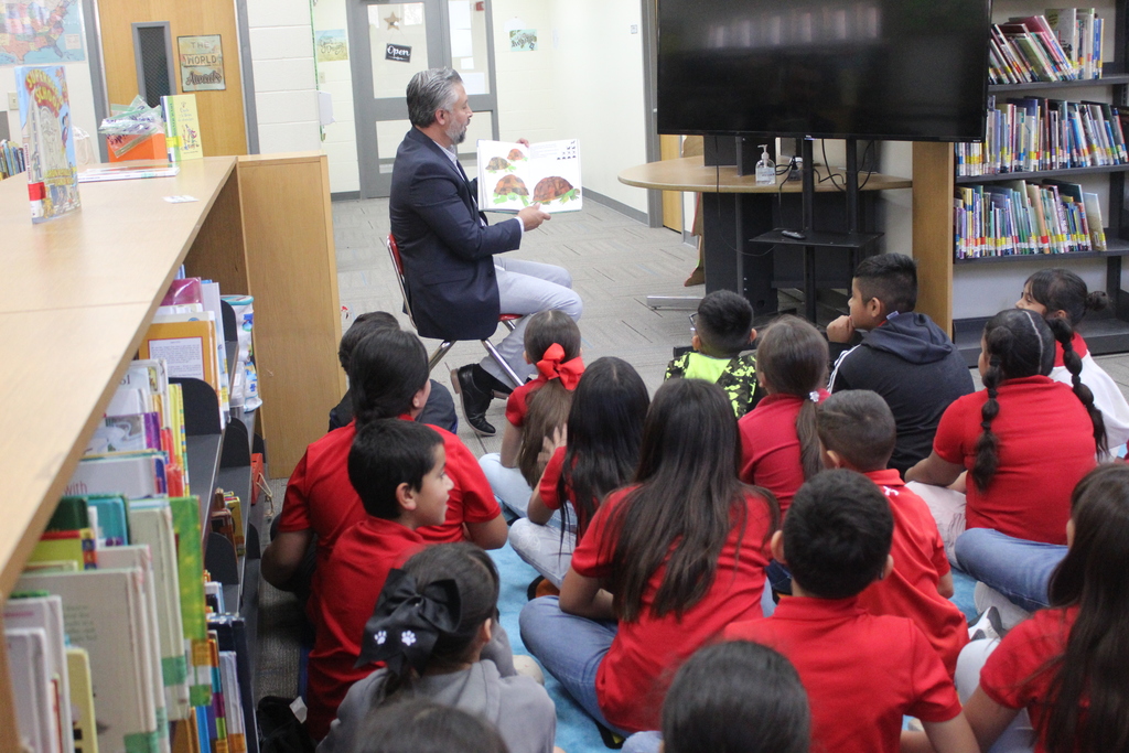 Read aloud by Mr. Olvera at the library with 3rd grade bilingual students