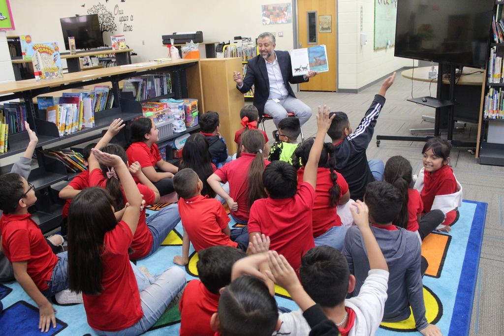 Read aloud by Mr. Olvera at the library with 3rd grade bilingual students