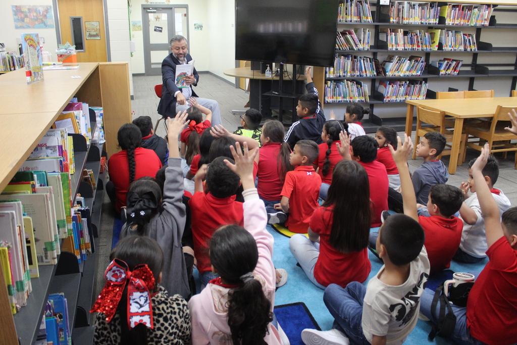 Read aloud by Mr. Olvera at the library with 3rd grade bilingual students