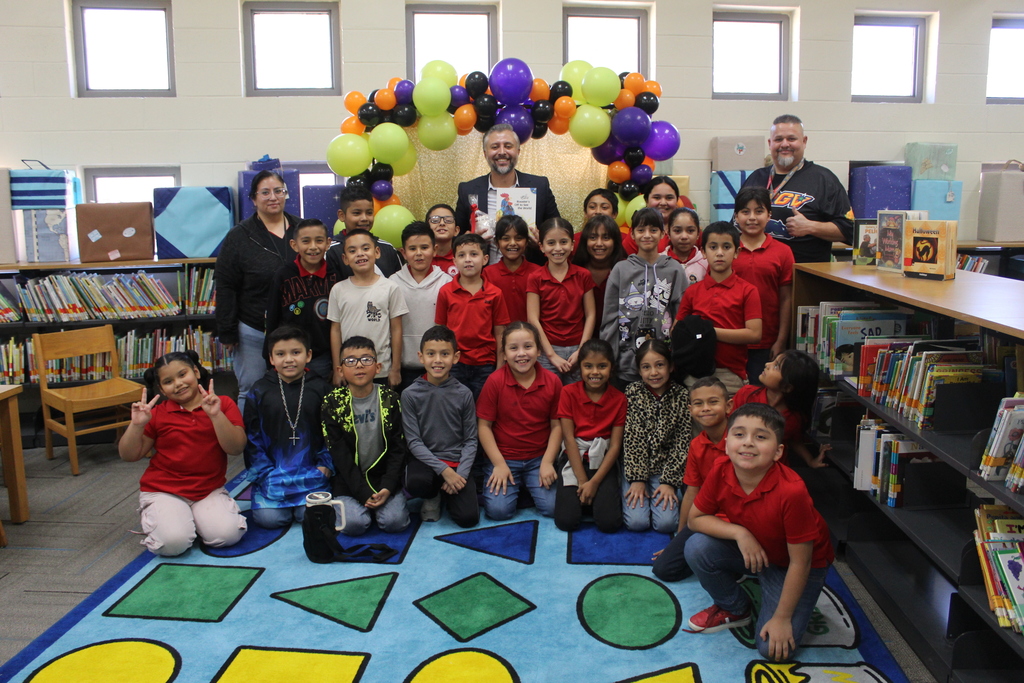 Read aloud by Mr. Olvera at the library with 3rd grade bilingual students