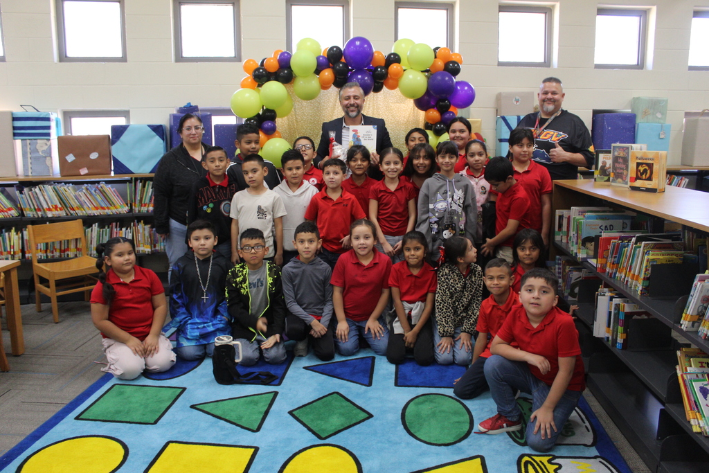 Read aloud by Mr. Olvera at the library with 3rd grade bilingual students