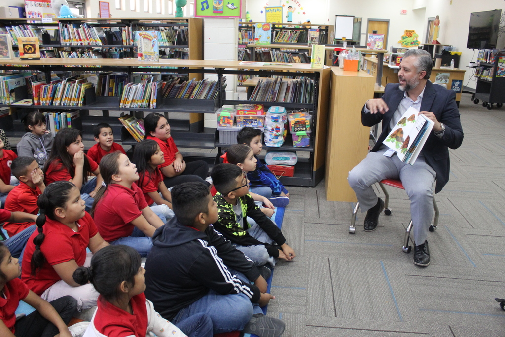 Read aloud by Mr. Olvera at the library with 3rd grade bilingual students