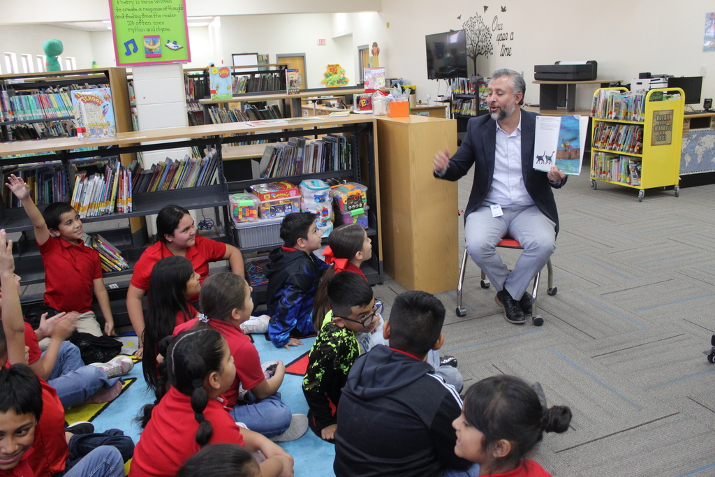 Read aloud by Mr. Olvera at the library with 3rd grade bilingual students