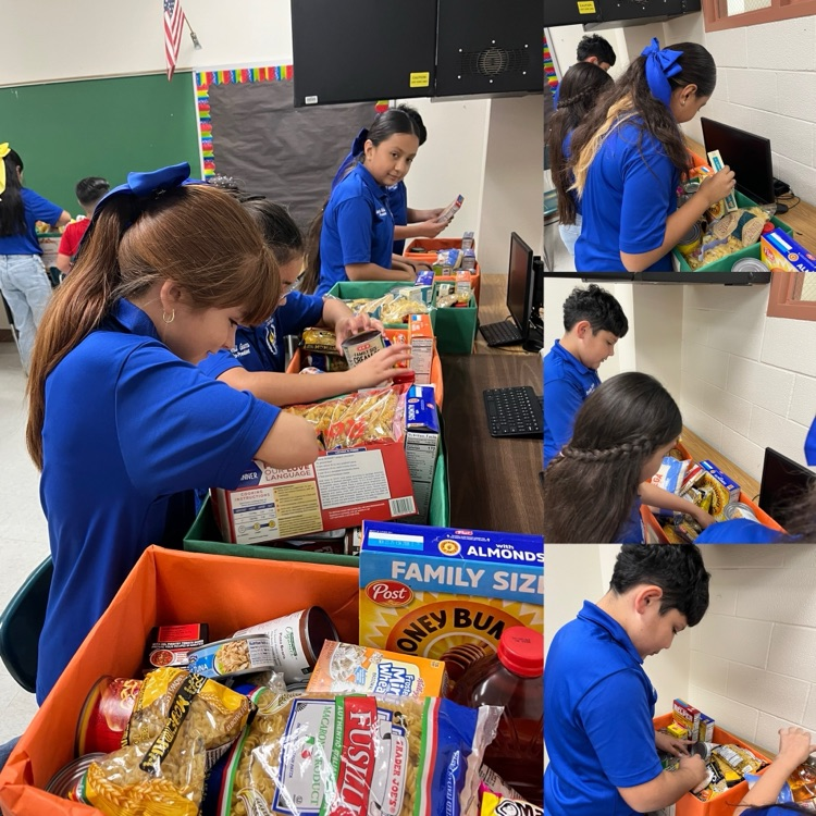 students and teachers distributing food boxes