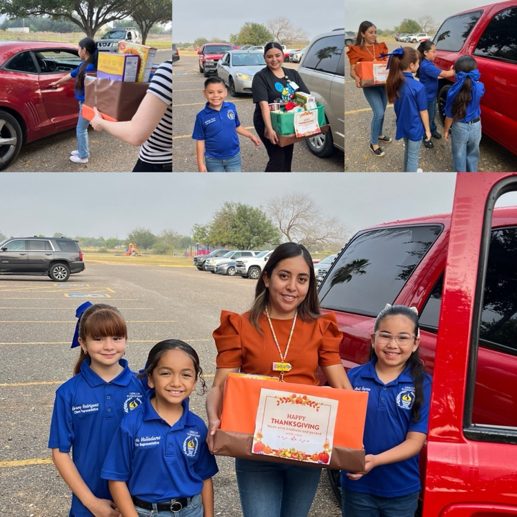students and teachers distributing food boxes