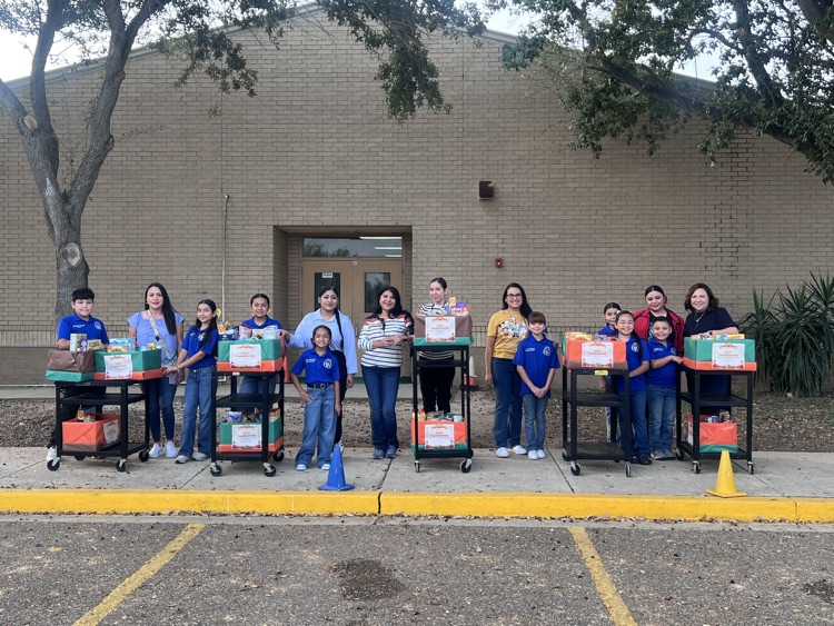 students and teachers distributing food boxes