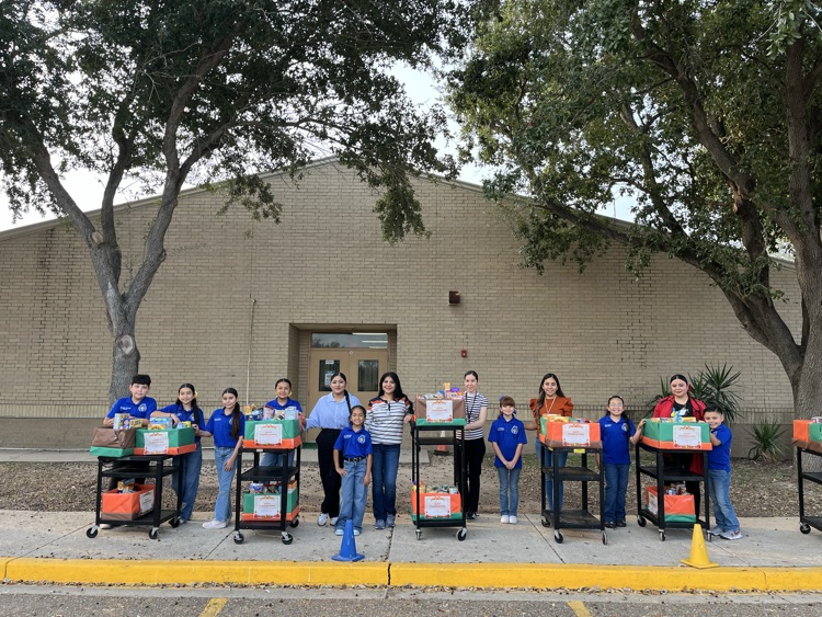 students and teachers distributing food boxes