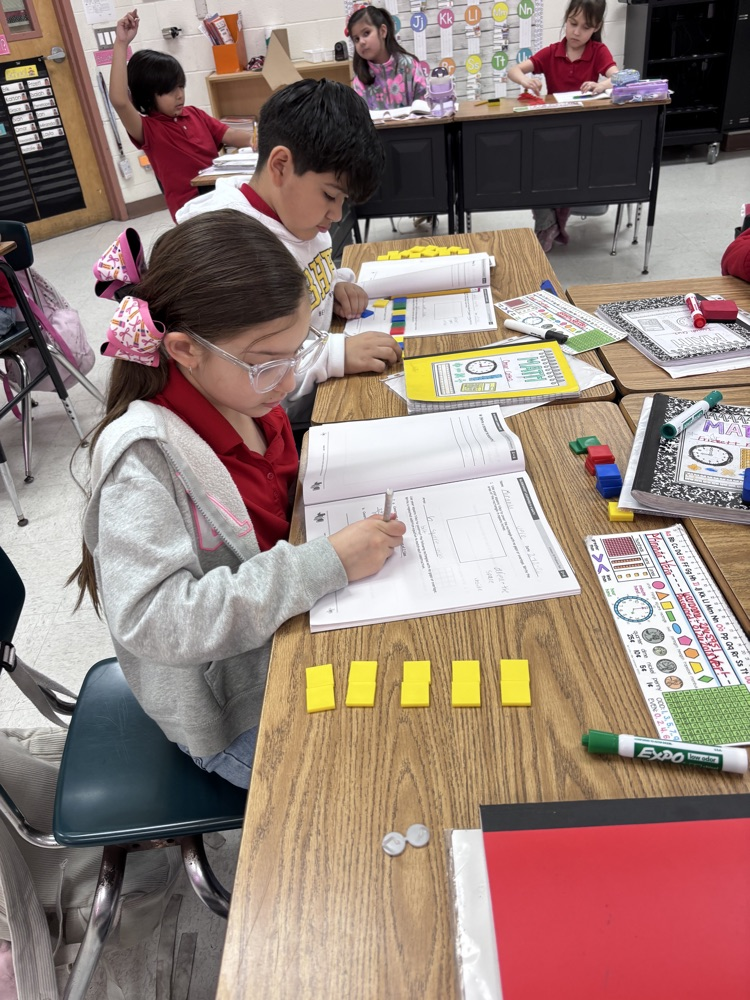 students using math manipulatives 
