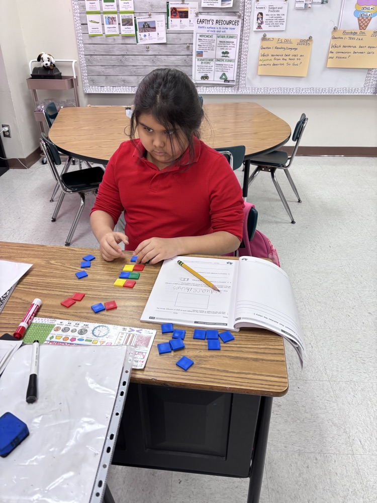 students using math manipulatives 
