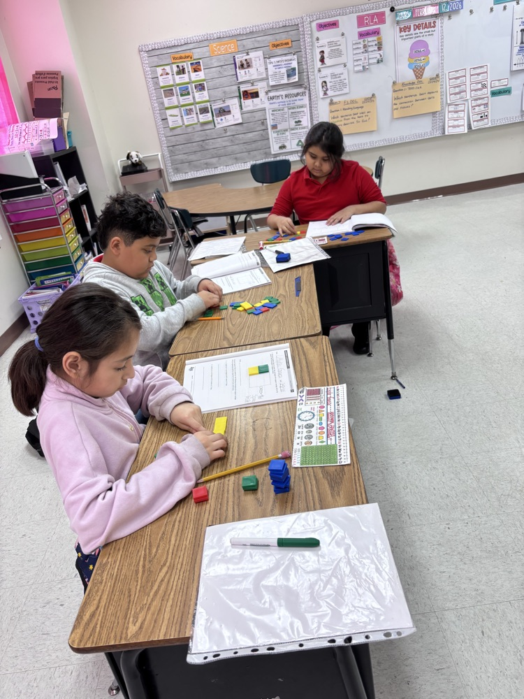 students using math manipulatives 