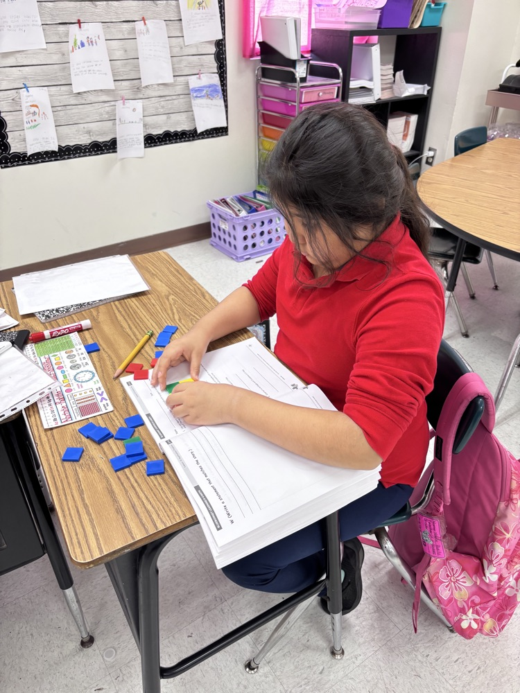 students using math manipulatives 