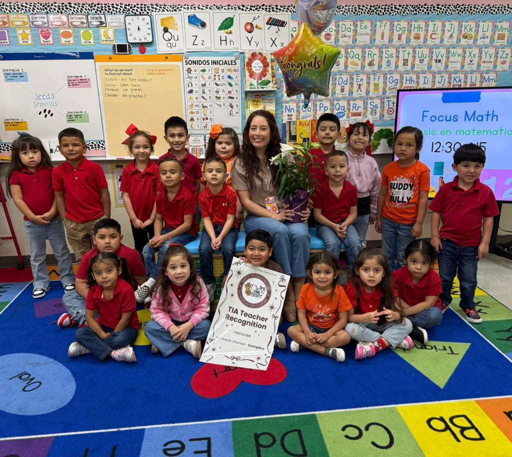 surprise visit from principal with balloons and plant