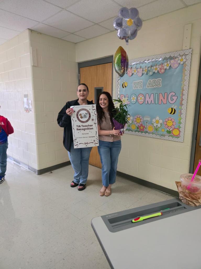 surprise visit from principal with balloons and plant