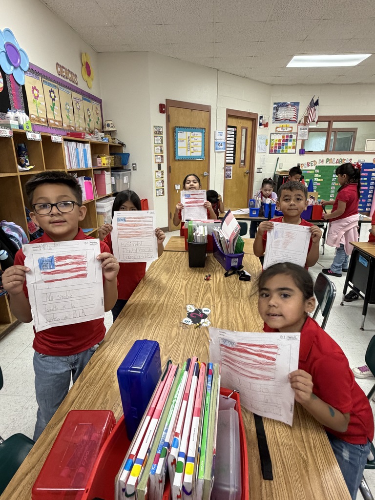 Students showing their social studies flag assignment 
