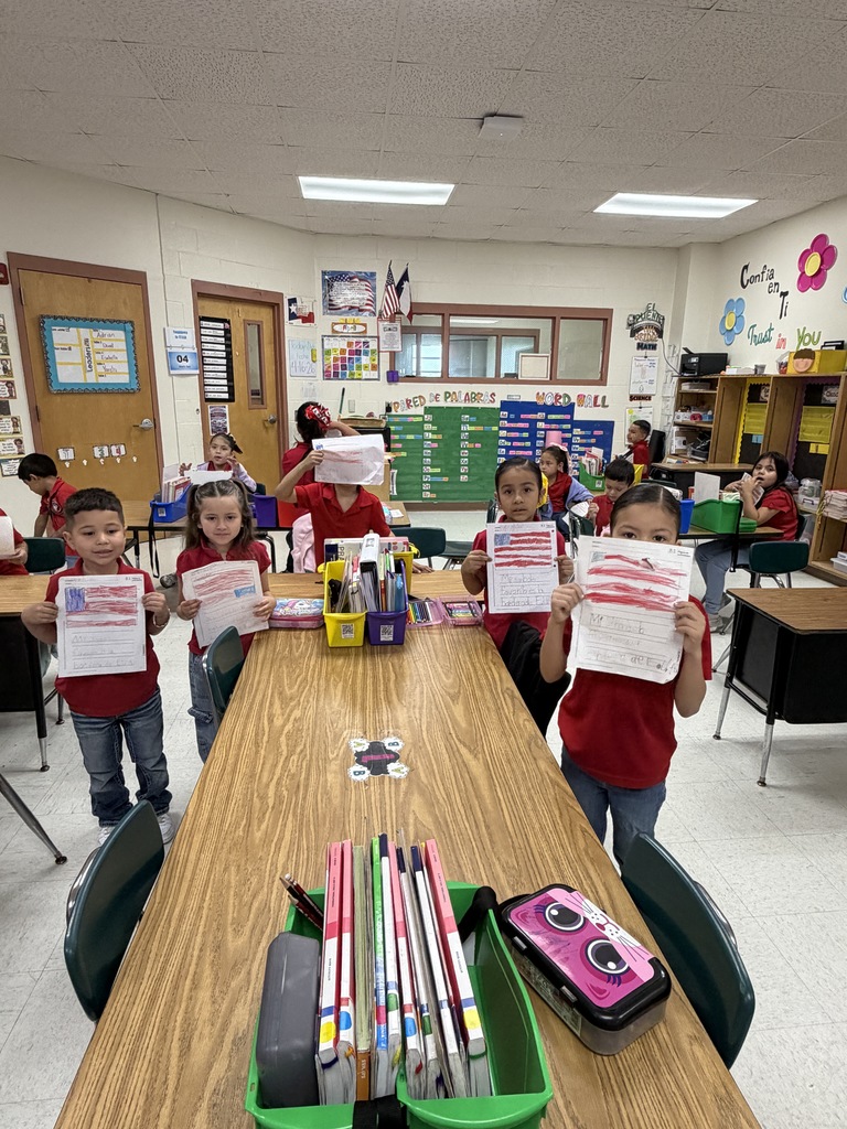 Students showing their social studies flag assignment 