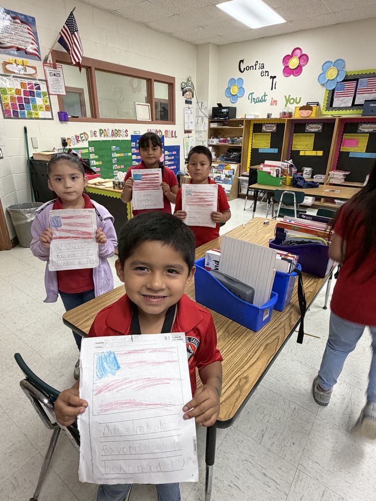 Students showing their social studies flag assignment 