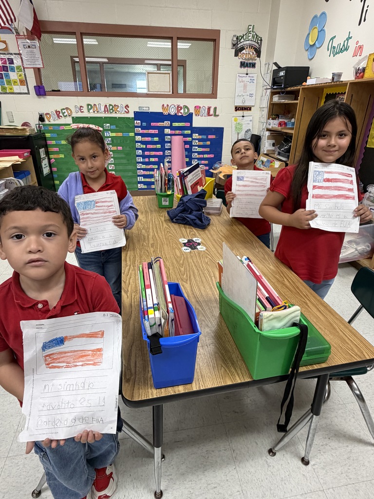 Students showing their social studies flag assignment 