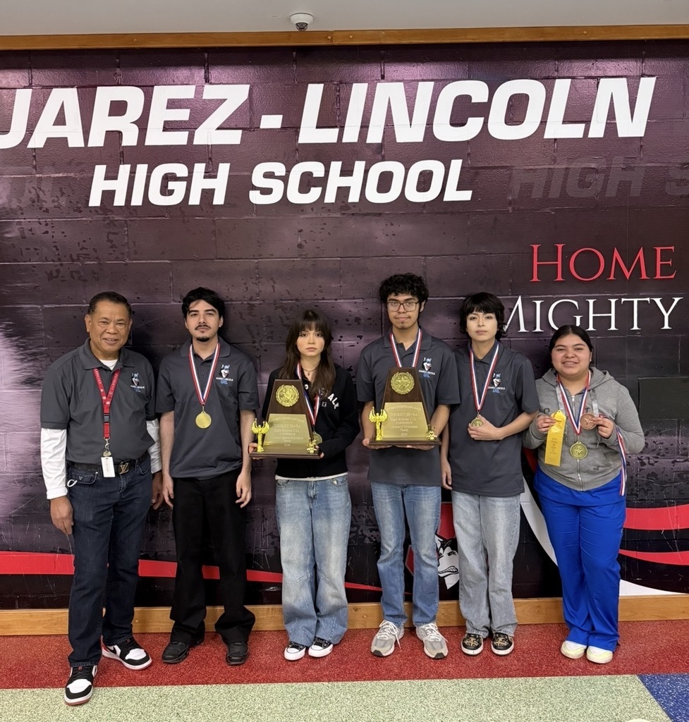 students holding trophies