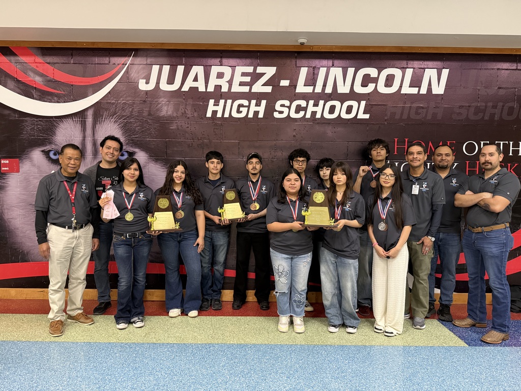UIL team holding trophies