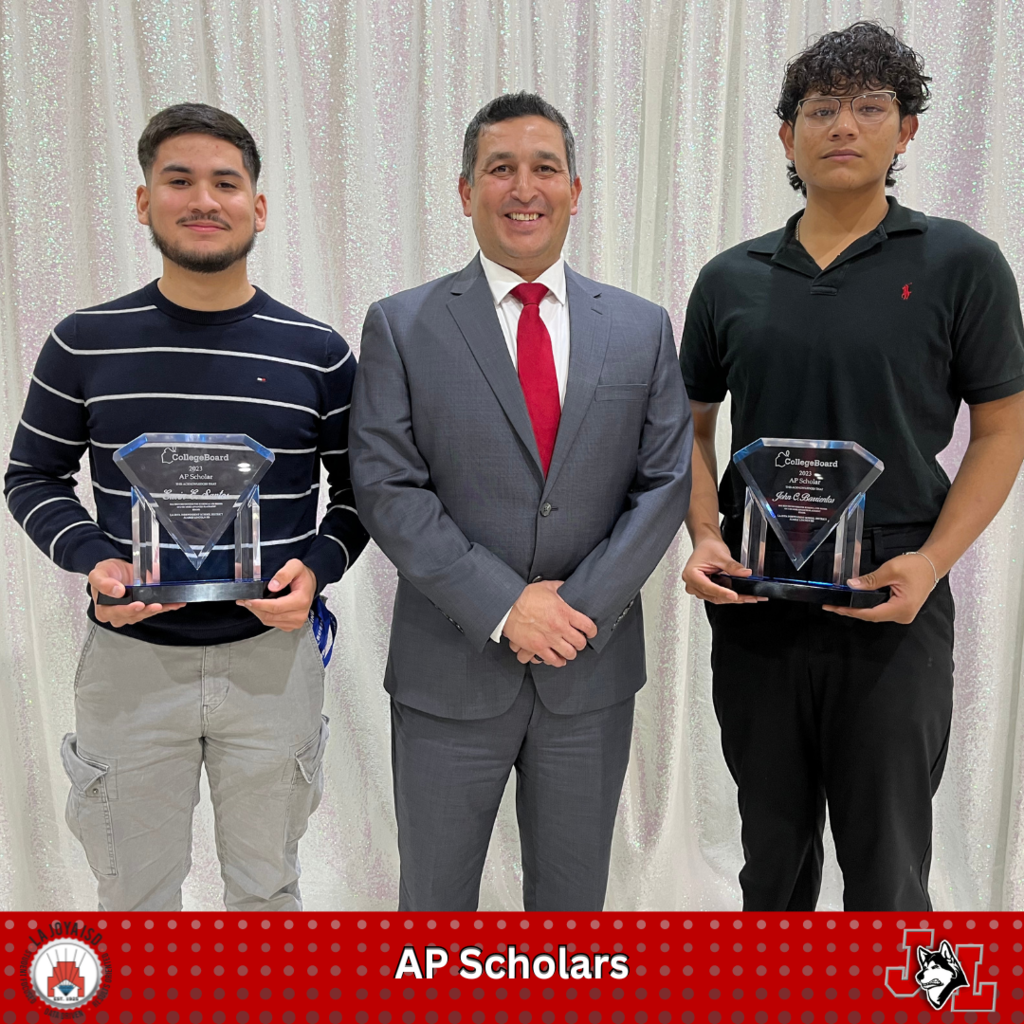 students posing with principal & trophies