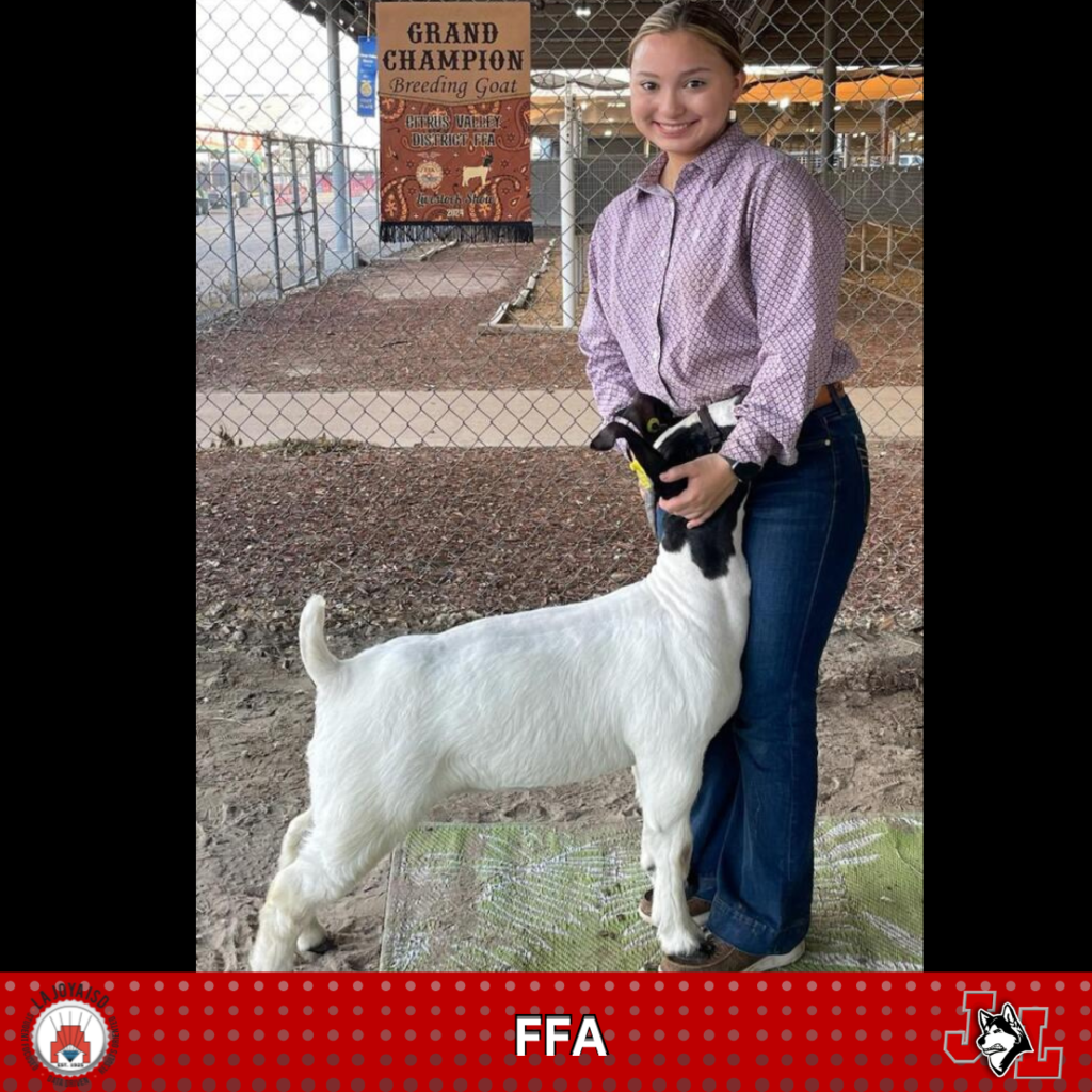 student posing with goat