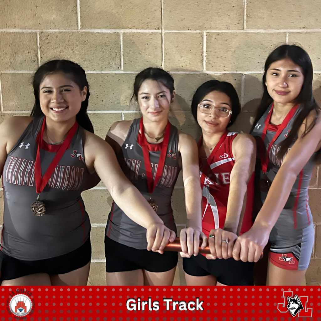 track girls posing with medals