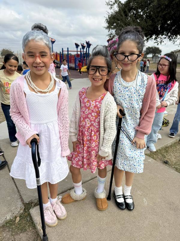 three girls in costumes