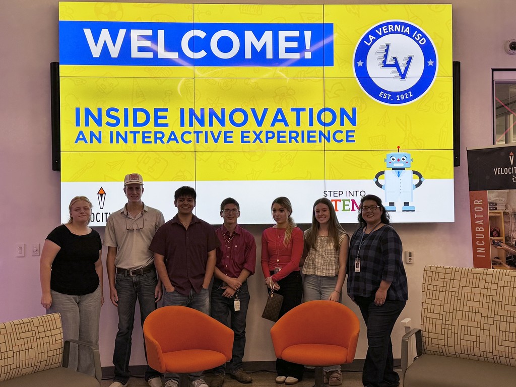 BP picture in front of sign