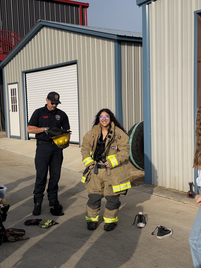 Student trying on fire fighter gear