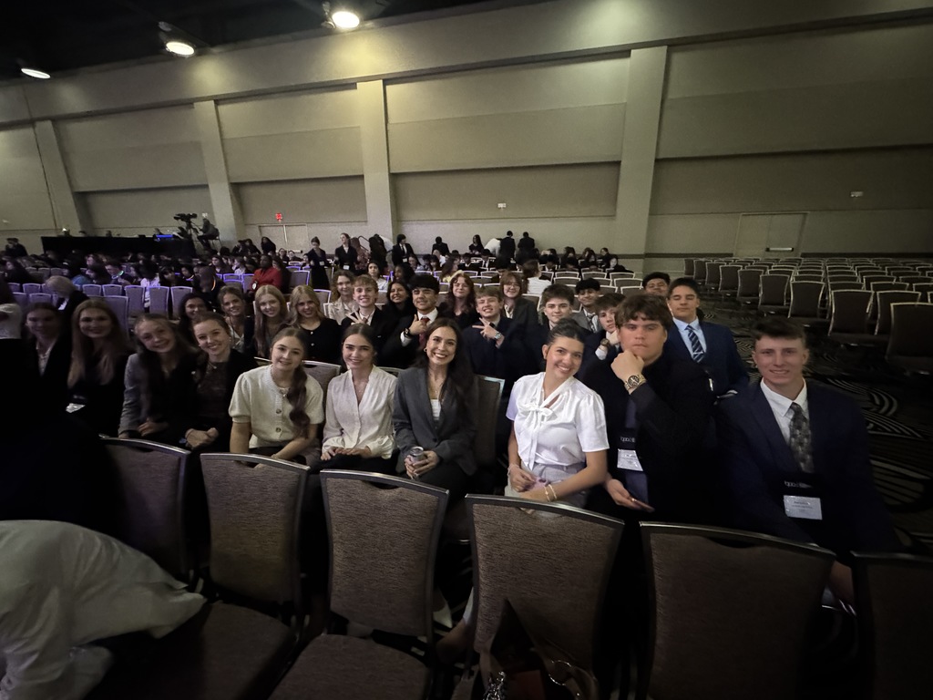 Photo of students in their seats at the conference