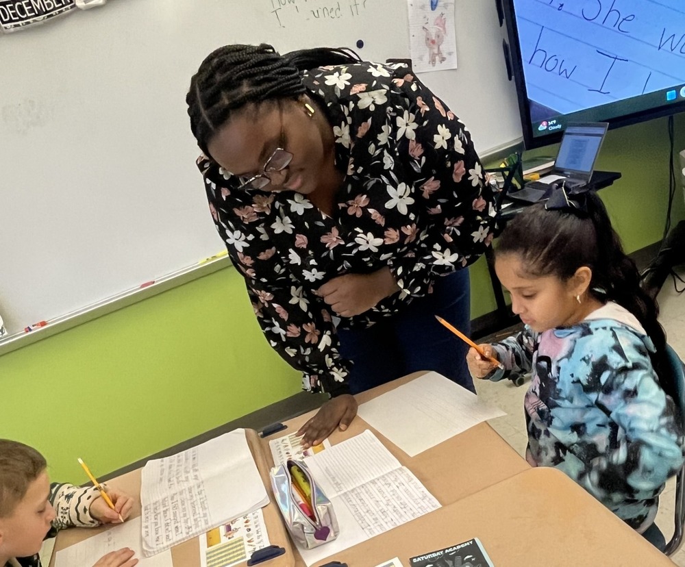 Ms. Blackburn works with students.