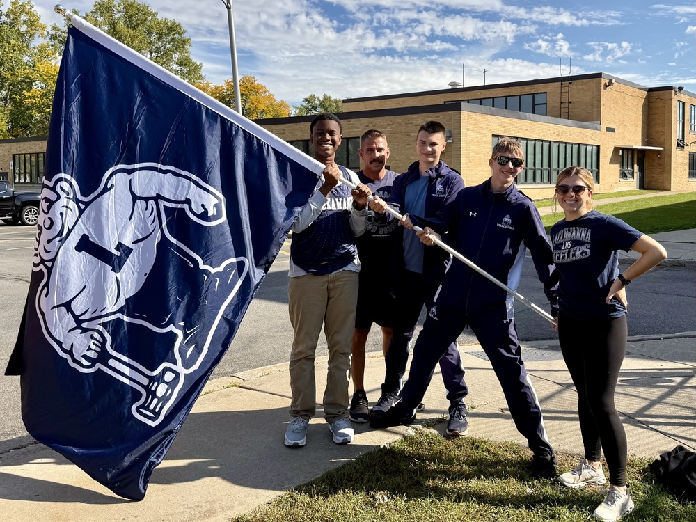 Lackawanna athletes hold a Steeler Flag