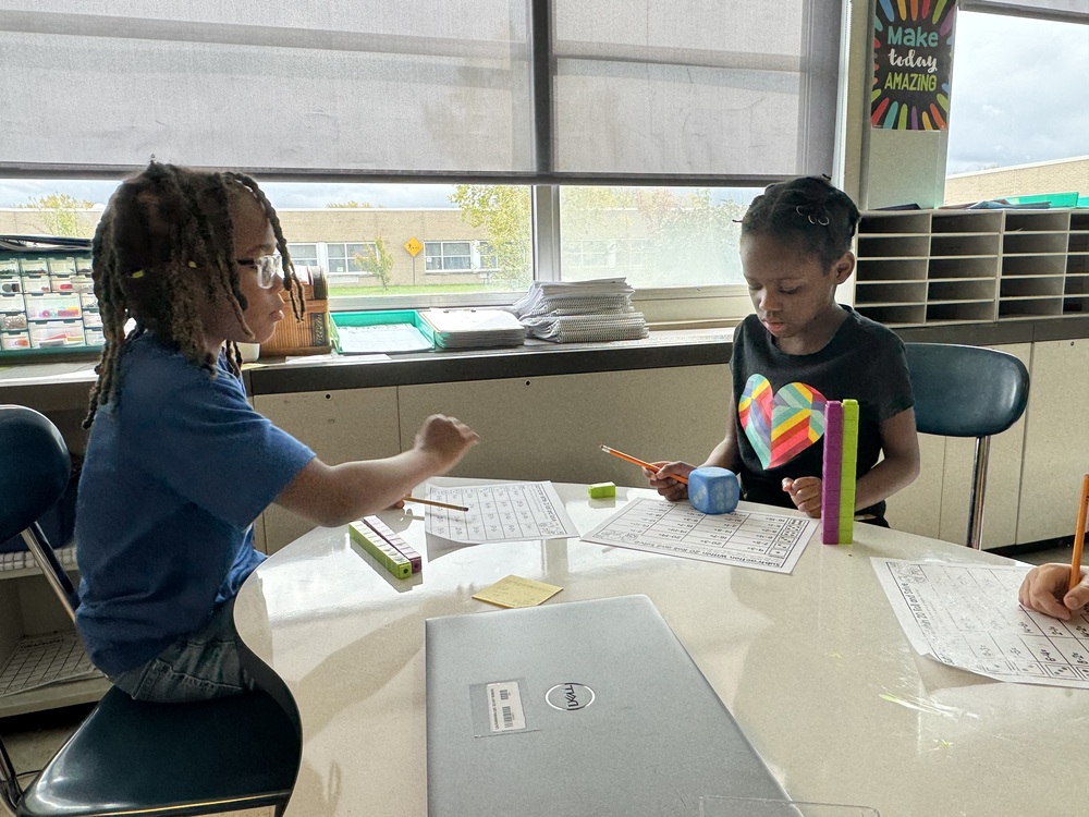 Children in a classroom working on math probelms