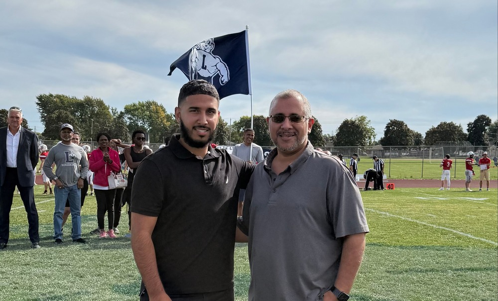 Abdulhamid Albaneh poses for a photo with a family member