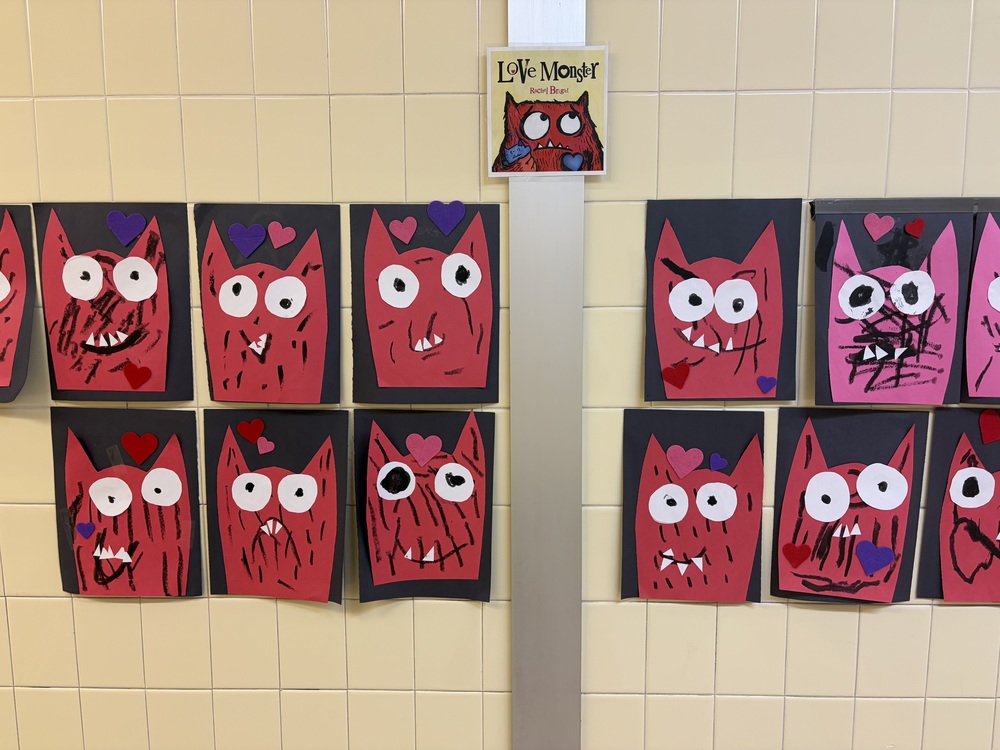 Student art hangs on the wall.