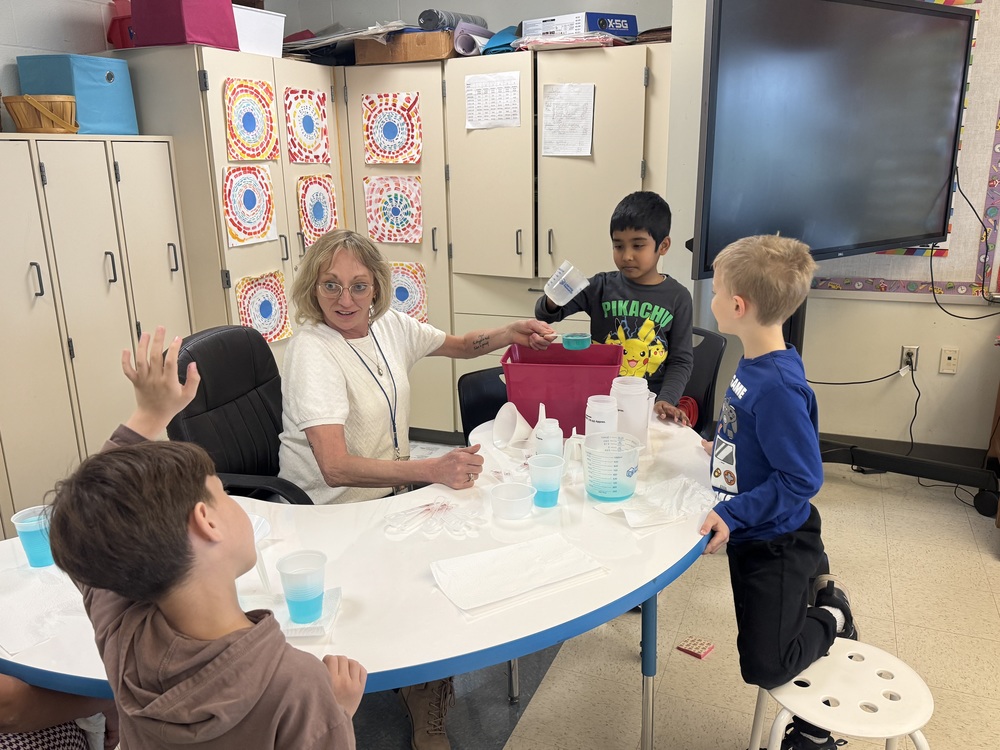 Students learn about liquid volume.