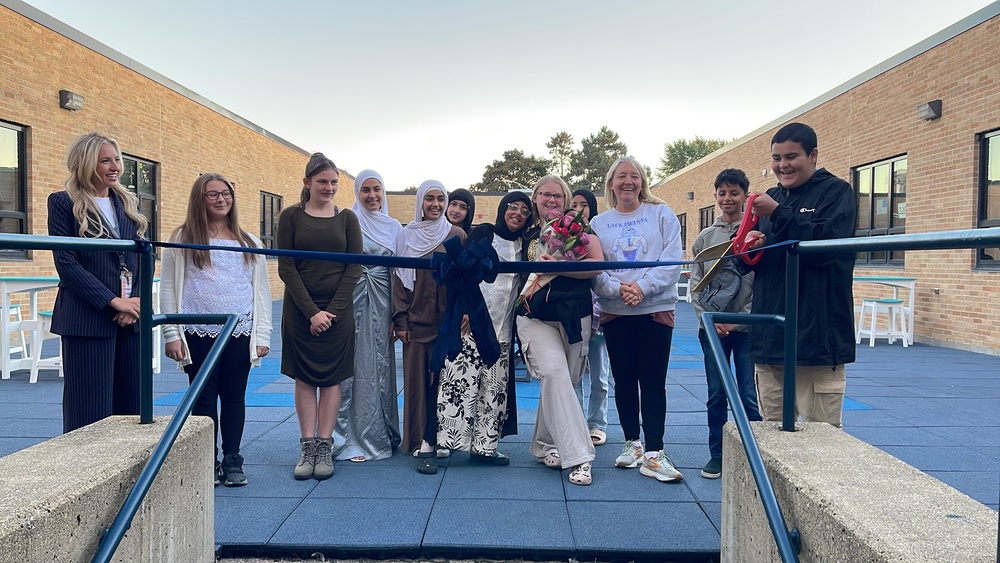 LMS students cut the ribbon to officially open the new courtyard