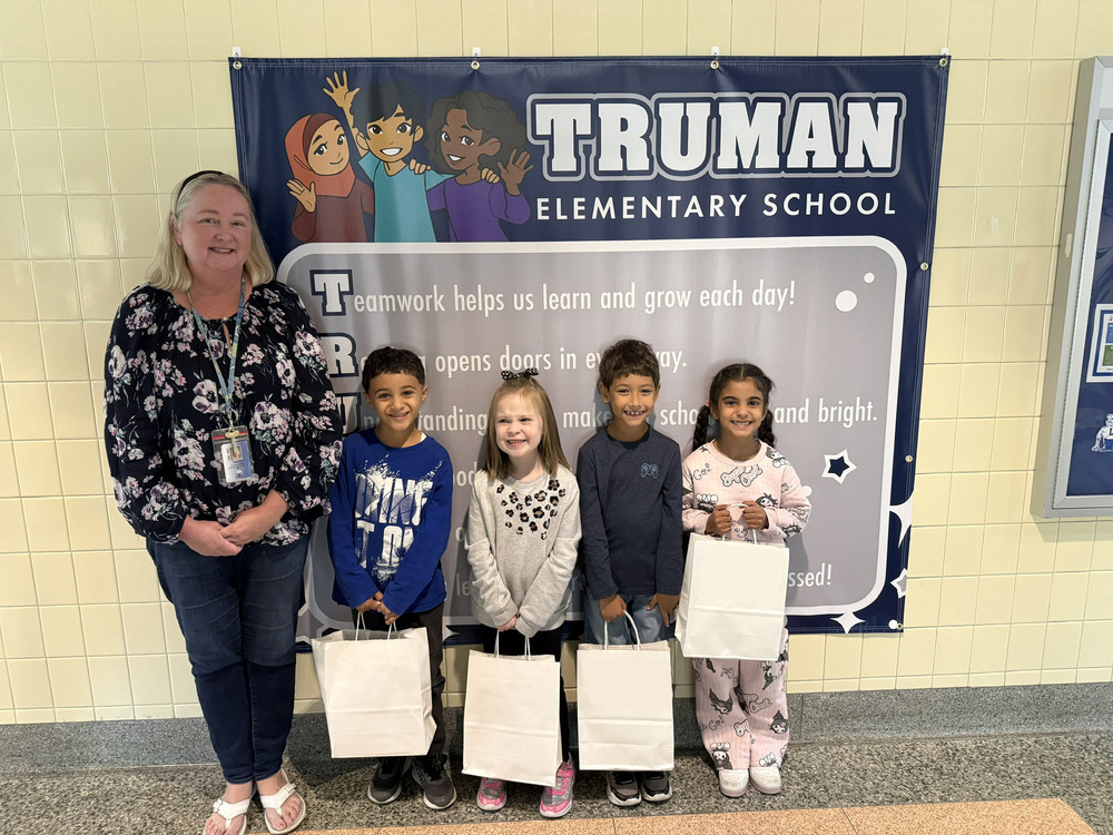 Students pose with gift bags